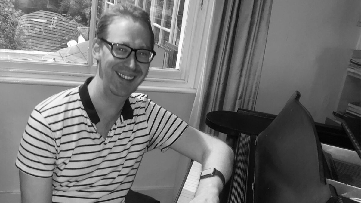Nick Hutson at a grand piano, from M Magazine's interview with him